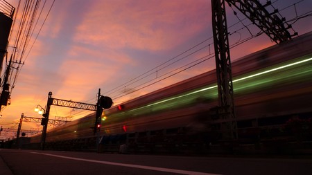 The train going toward the sunset sky.の写真素材