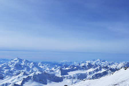 beautiful winter mountains with blue sky, snowy peaks. amazing scenic nature landscape.の写真素材