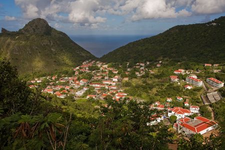 View of village from summit of tropical island of Sabaの写真素材