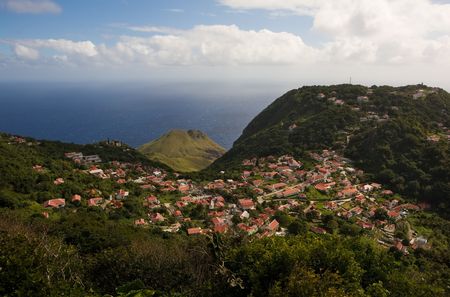 View of village from summit of tropical islandの写真素材