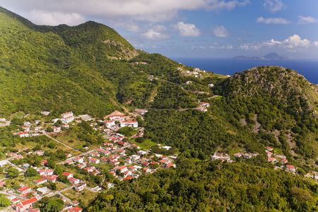 Village of remote Saba seen from top of nearby hillの写真素材