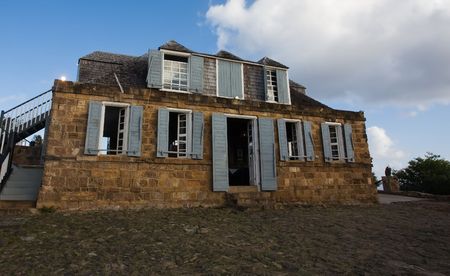 Historic buildings at harbour on tropical islandの写真素材