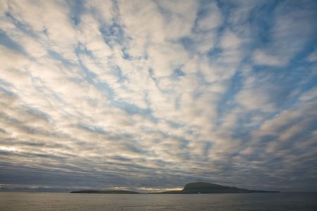 Dramtic clouds above the islands and ocean, Faroe Islands, Scandinaviaの写真素材