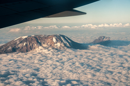 The view on the flight home from Kilimanjaro with the mountain sticking up above the clouds の写真素材