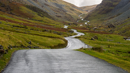 A high level route through the English Lake District with an old slate mine at the summit of the Passの写真素材