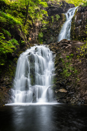 A well hidden wonder in the village of Uig on Skye is this magnificent double waterfall on the River Rhaの写真素材