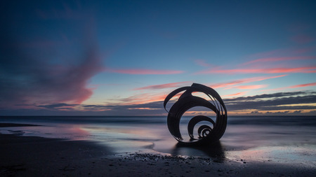 Sunset at the beach at Cleveleys on the Lancashire Coast with the artwork Mary's Shell  in the foreground DIGITAL CAMERAの写真素材