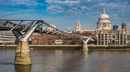 Millennium Bridge, St Pauls Cathedral and embankment of the River Thames in Central London, UKのeditorial素材