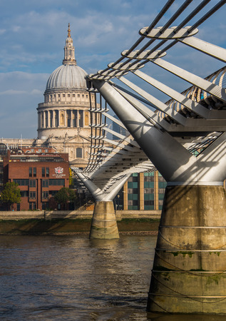 Millennium Bridge, St Pauls Cathedral and embankment of the River Thames in Central London, UKのeditorial素材