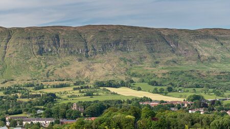 The village of Lennoxtown with the High church of Campsie in Lennoxtown, prominent in the imageの写真素材