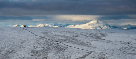Looking over to Ben Lomond covered in snow from the Campsie Fellsの写真素材