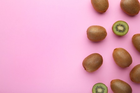 Fresh kiwi fruit on pink wooden backgroundの写真素材