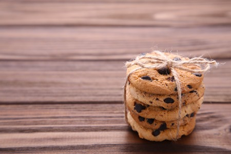 Chocolate cookies on grey table. Chocolate chip cookies on grey wooden background