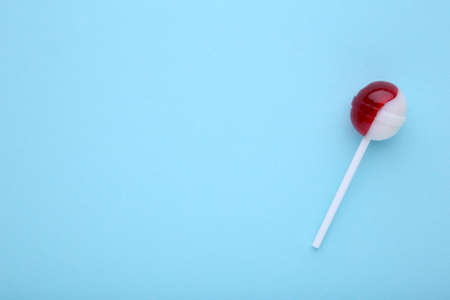 Candy lollipop on a blue background.の写真素材