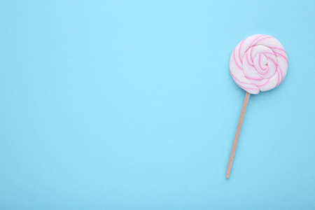 Candy lollipop on a blue background.の写真素材
