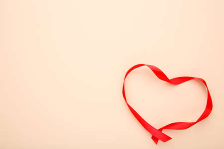 Ribbons shaped as hearts on beige, valentines day