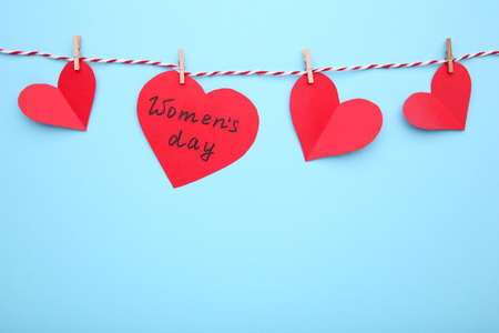 Women's day card with hearts on blue background with copy spaceの写真素材