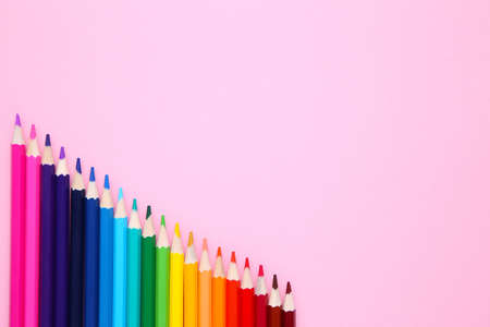 Many different colored pencils on pink backgroundの写真素材