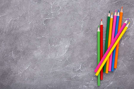 Many different colored pencils on gray concrete backgroundの写真素材