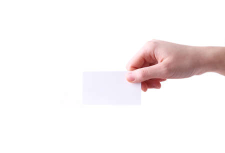 Woman holding white business card in hand isolated on a white background. Tamplate for your design.