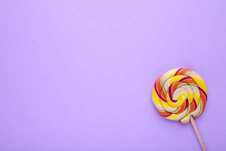 Colorful lollipop on purple background. Studio shotの写真素材