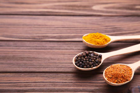 Spices mix on brown wooden background.の写真素材