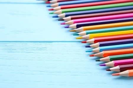 Many different colored pencils on blue backgroundの写真素材