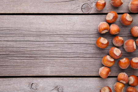 Delicious hazelnut on a gray wooden backgroundの写真素材