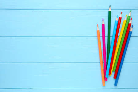 Many different colored pencils on blue backgroundの写真素材