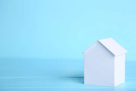 Concept of house in paper on wood. Horizontal composition. Top view.の写真素材