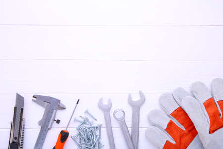 Different construction tools on wooden background with copy space.の写真素材