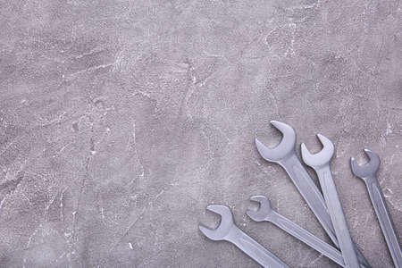 Combination wrenches for repair on gray table, copy spaceの写真素材