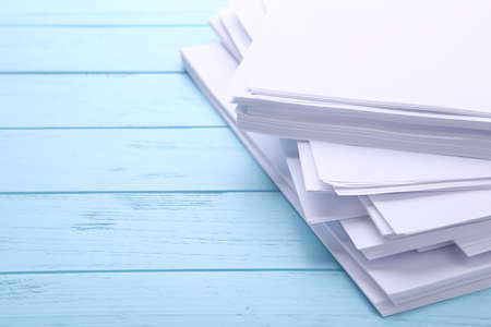 Stack white paper on blue background