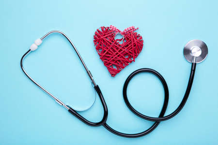 Stethoscope and heart on colorful background. Health care conceptの写真素材