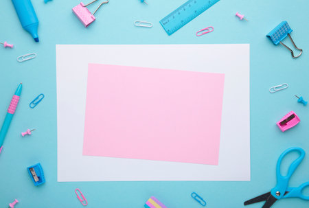 School accessories on soft blue background. Back to school concept. Creativity for kids. Colorful school background. Flat lay, top view, copy spaceの写真素材