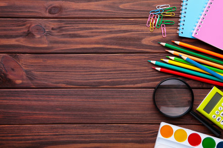 Back to school concept on brown background with copy spaceの写真素材