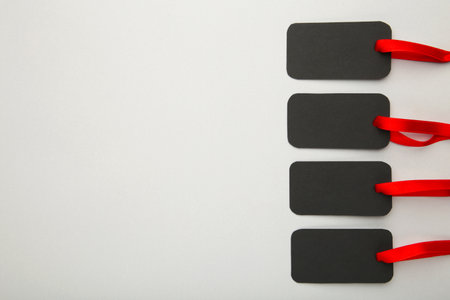 Blank price tags on gray with soft shadow, clipping path includedの写真素材