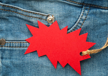 Blue jeans detail with red tag. Black friday, macroの写真素材