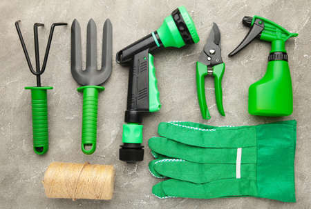 Gardening tools on gray concrete background. Spring conceptの写真素材