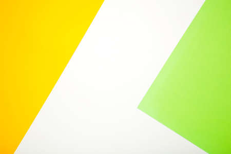 Color papers flat composition background with yellow, white and green color with copy space. Top viewの写真素材