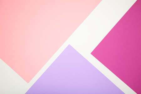 Paper textured background has three colors, dark and light pink. Top view