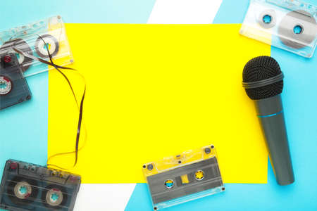 Microphone and cassette on blue background. Top viewの写真素材