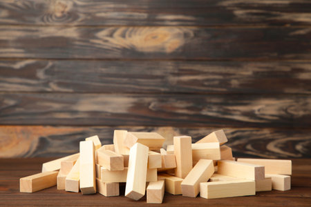 Wooden blocks disrupted on brown background.