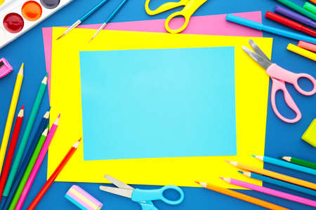 Back to school concept on blue background with copy space. School stationery with copy spaceの写真素材