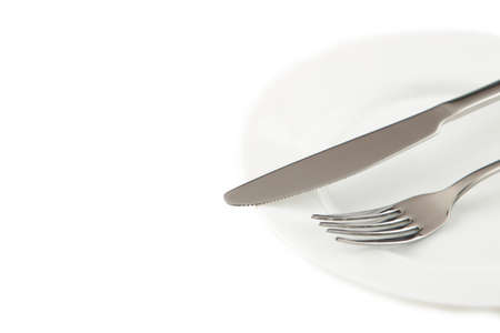 Dining etiquette - the meal is over or finished. Fork and knife signals with location of cutlery set. Photo isolated on white background. Set of foto 7 from 7. Top viewの写真素材