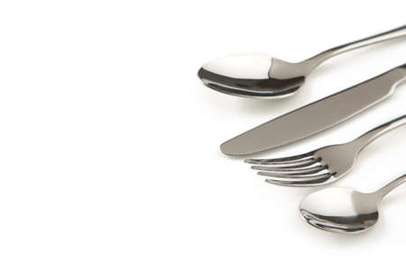 Table setting with cutlery - fork, spoon and knife isolated on white. Top viewの写真素材