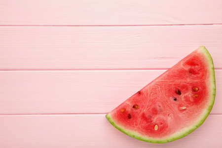 Red watermelon on pastel pink background. Summer concept. Watermelon pattern.の写真素材