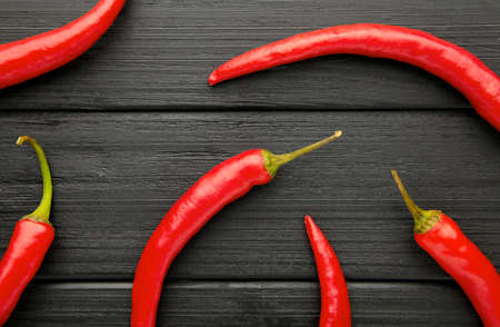 Red hot chili peppers on black background. Top viewの写真素材