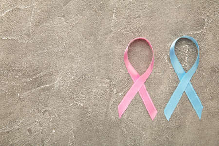 Blue and pink symbolic ribbon - the problem of cancer, breast cancer, prostate cancer ribbon. Top viewの写真素材