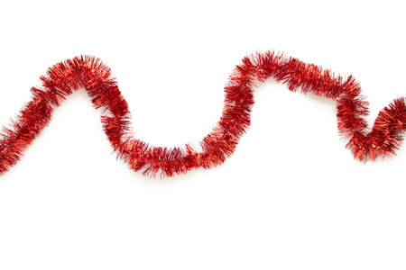 Christmas red tinsel isolated on white background. Top view.